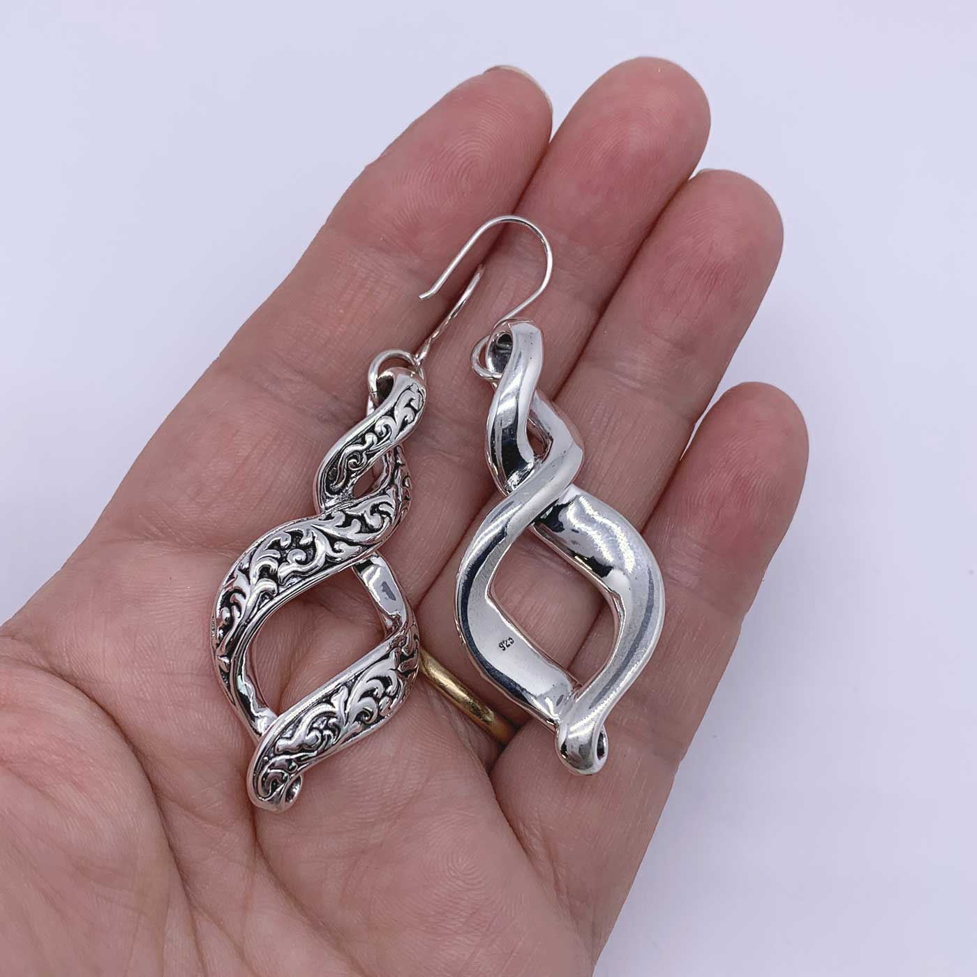 silver koru earrings