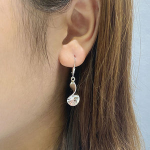silver twist leverback earrings being worn