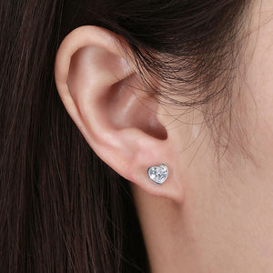 silver heart stud earrings ear