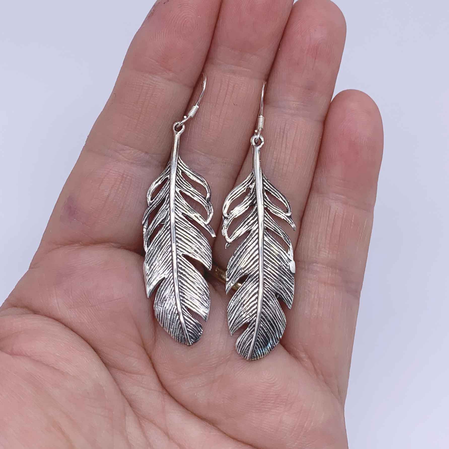 silver feather earreings