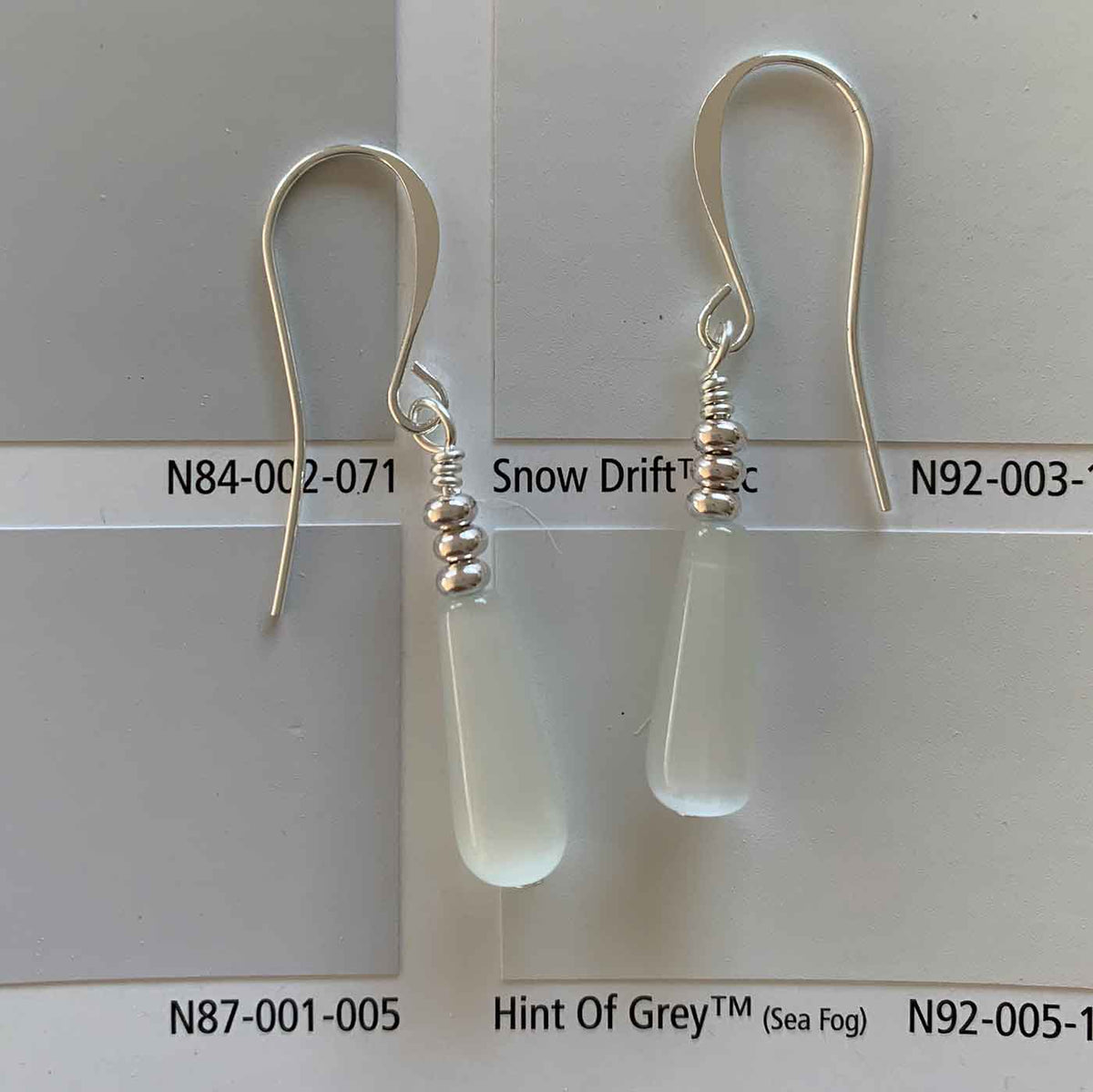 white drop silver earrings