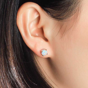 white opal silver stud earrings ear