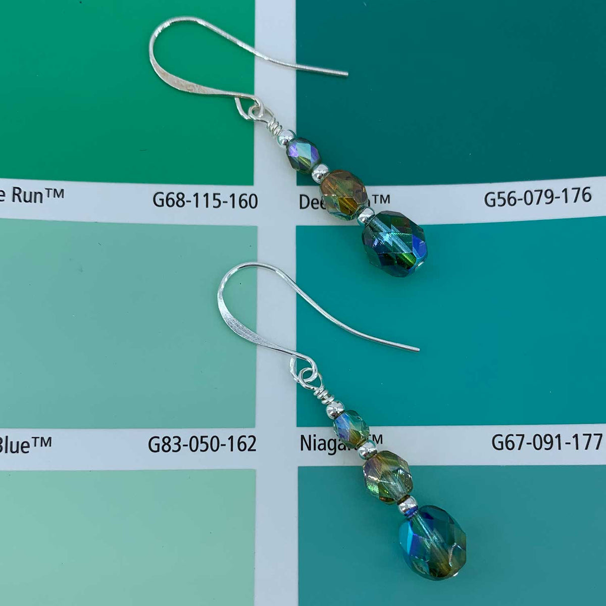 green crystal drop silver earrings