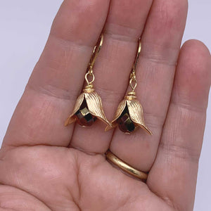 gold tulip dangle earrings hand