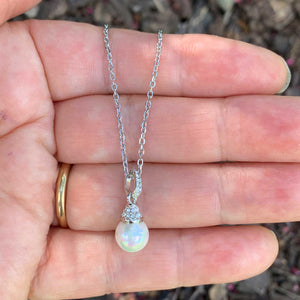 white pearl crystal necklace in hand