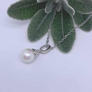 white pearl crystal necklace with plant