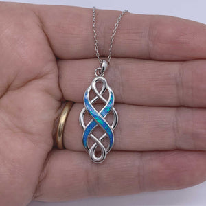 celtic pattern silver necklace blue opal hand