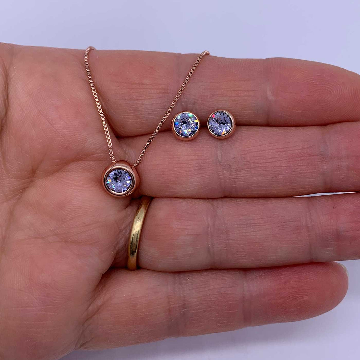 rose gold jewellery set pale blue hand