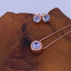 rose gold jewellery set pale blue wood