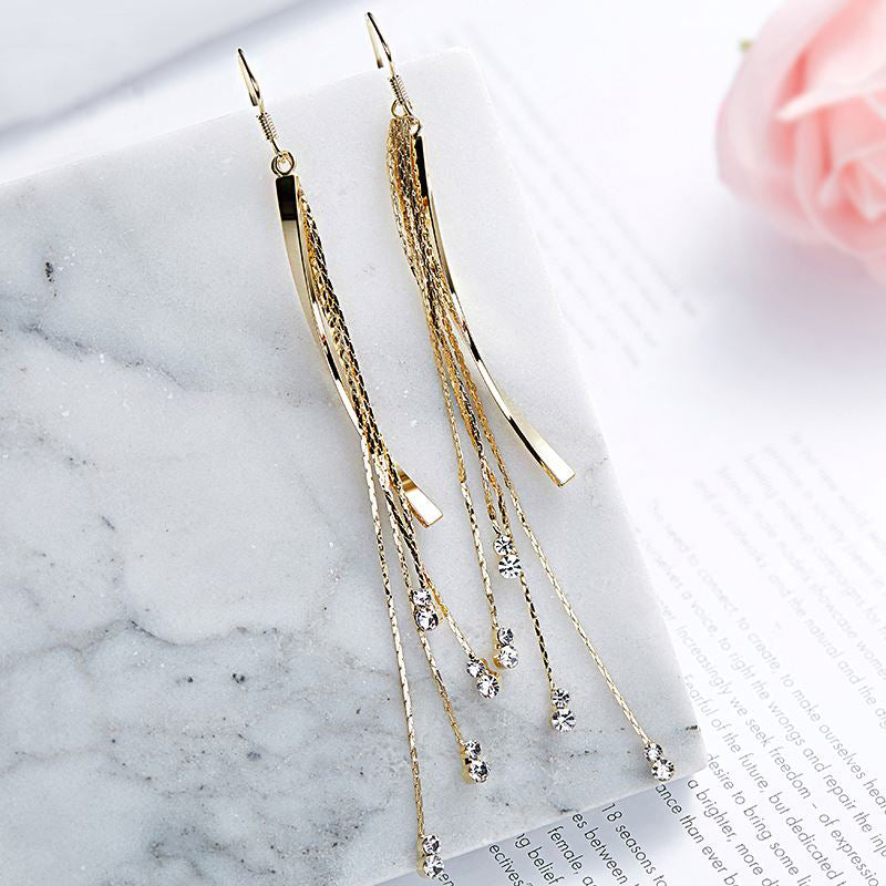 FRENELLE Jewellery Long Gold Boho Tassel earring crystals